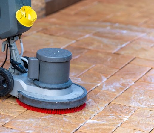 Tile Cleaning Pros use a scrubbing machine to clean tile and grout.